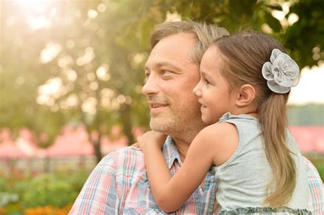 Premium Photo Happy Father And Daughter Hugging Outdoors