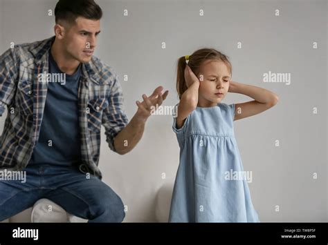 Man Scolding His Daughter At Home Stock Photo Alamy