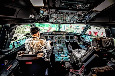 Air Canada Pilots At A Cockpit Photograph By Michelle Saraswati