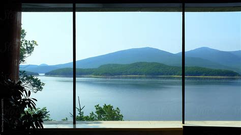 Scenic View Of Lake Seen Through Window By Miss Rein Stocksy United