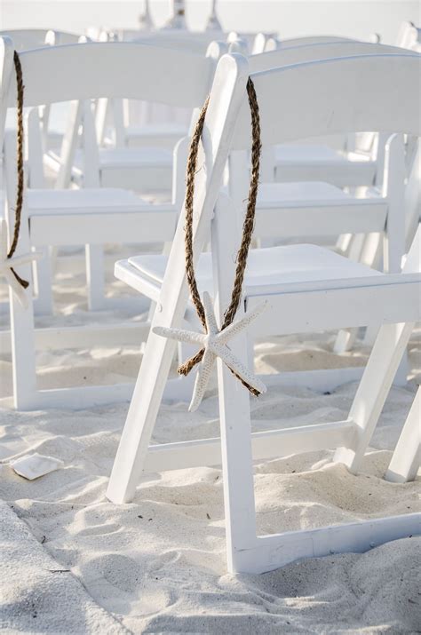 Officiant, wedding arch, chairs, photographer, flowers. #haydaywedding Starfish Ceremony Chair Decor | Beach ...