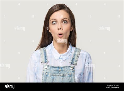 Headshot Of Nerdy Surprised Millennial Woman Showing Fishface Grimace