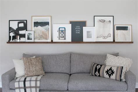 Diy Picture Ledge Over The Couch Filled With Art The Diy Playbook