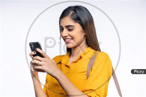 Image Of Smiling Young Indian Woman Using Mobile Phone Wg412667 Picxy
