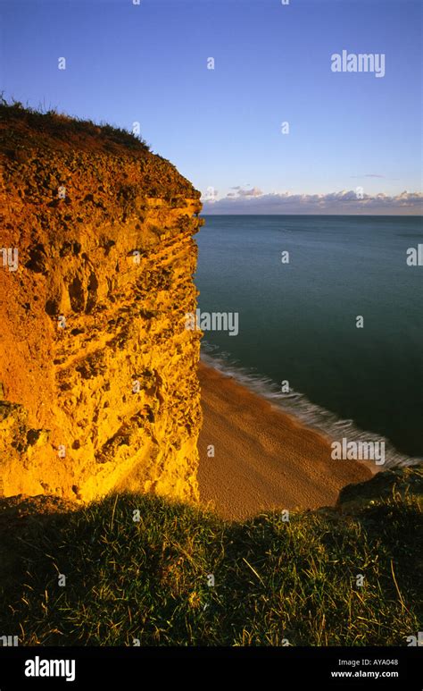 Sunset On Coastal Cliff Face At West Bay In Dorset County England Uk