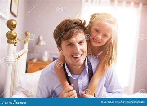 Daughter Hugging Father As He Gets Dressed For Work Stock Image Image Of Father Portrait