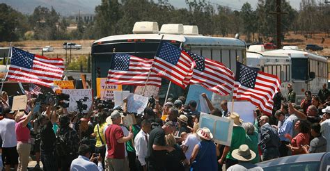 Demonstrators Picket Against Arrival Of Buses Carrying Undocumented