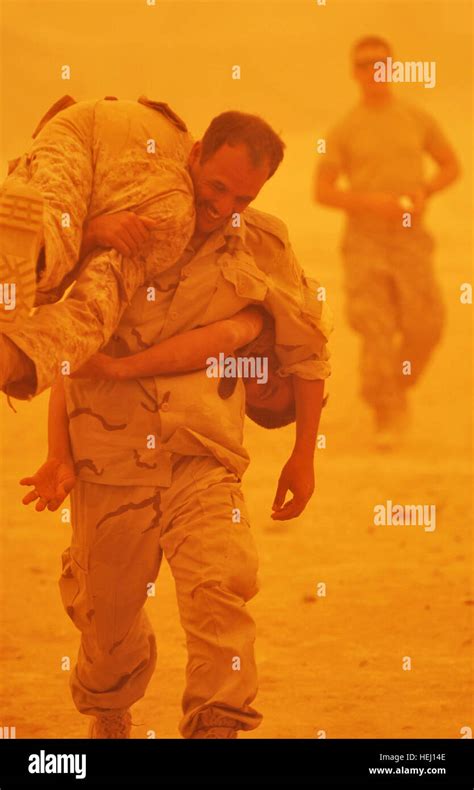 An Iraqi Soldier Rushes His Comrade To Safety Using The Buddy Carry