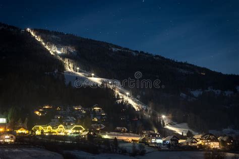Illuminated Ski Slope At Austrian Alps At Starry Night Stock Photo
