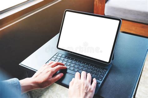 Hands Using And Typing On Tablet Keyboard With Blank White Desktop