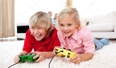 Adorable Children Playing Video Games Stock Photo By ©wavebreakmedia