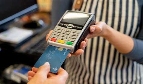 Maybe you would like to learn more about one of these? Close Up Of Unrecognizable Customer Paying With Credit Card At A Grocery Store While Saleswoman ...