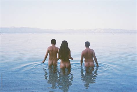 Three Naked Friends In The Sea During Morning By Stocksy Contributor Mak Stocksy