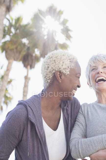 Two Senior Women Laughing Together — Focus On Foreground Enthusiasm