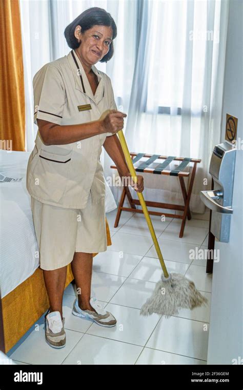 Mercure Comercial Hotel Hispanic Woman Female Housekeeper Cleaning Mopping Hi Res Stock