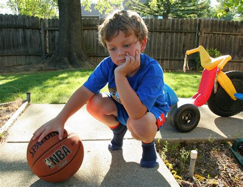 bored aidan bored while posing with a basketball and a b… flickr
