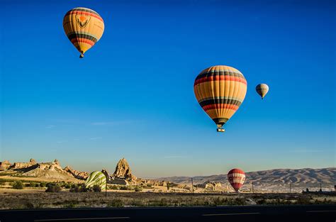 Free Photo Four Beige Hot Air Balloons Flying Adventure