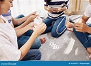 Young people playing cards stock image. Image of playing - 161650947