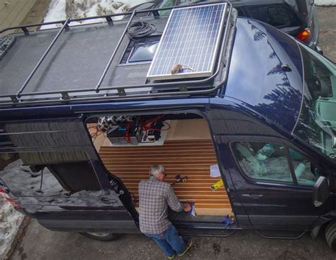 Great View Of The Aluminess Roof Rack With Solar Panel On Top Of A