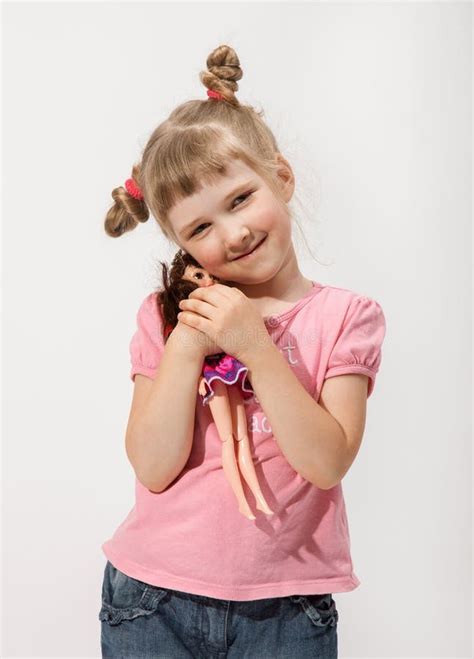 Smiling Little Girl Holding A Doll Stock Image Image Of Child