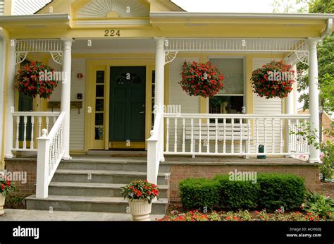 Victorian Front Porch With Potted Hanging Plants Stock
