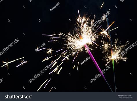 Two Sparklers Lit On Black Background Stock Photo 1853228419 Shutterstock