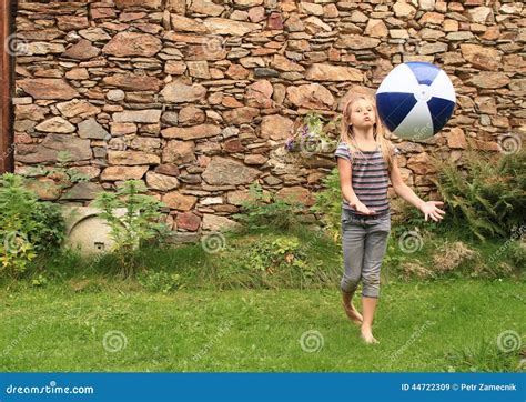 Girl Bouncing Inflating Ball Stock Image 44722309