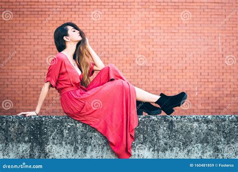 Beautiful Young Woman Posing On Front Of Brick Wall Stock Image Image