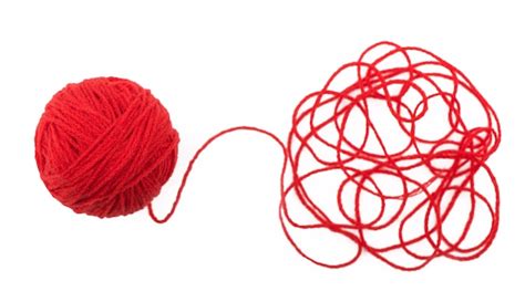 Premium Photo Tangled Thread And Red Ball Of Yarn On White Surface