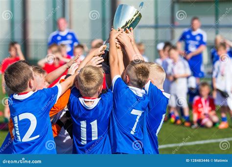 Young Soccer Players Holding Trophy Boys Celebrating Soccer Football