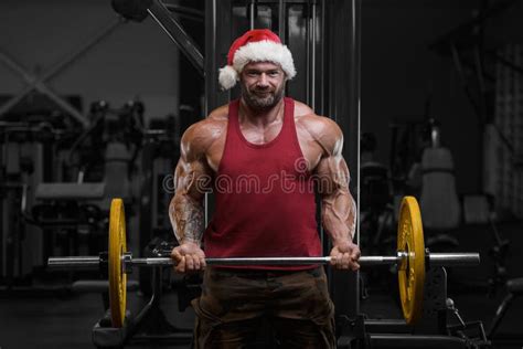 Bodybuilder In Santa Claus Costume In The Gym Stock Image Image Of Dumbbell Athlete 165919659