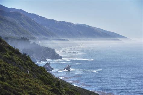 Misty Coast With Cliffs In Sunset Pacific Highway In Big Sur Area Stock