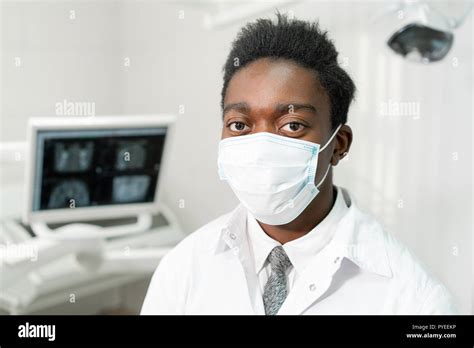 Young African American Male Doctor Dentist In A Medical Mask Medicine