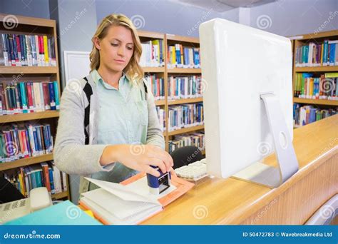 Pretty Librarian Working In The Library Stock Image Image Of Stamping