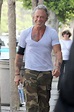 Mickey Rourke, 62, is lean and mean in camouflage as he shows off a ...