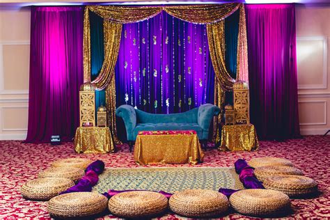 bold gem tones for the mehndi sangeet dholki stage backdrop indian pakistani bengali wedding