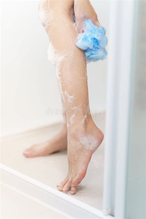woman washing her leg with bath sponge stock image image of caucasian health 182955397