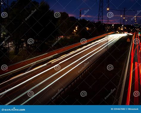 Lights Of Cars On The Highway At Night Long Exposure Stock Photo