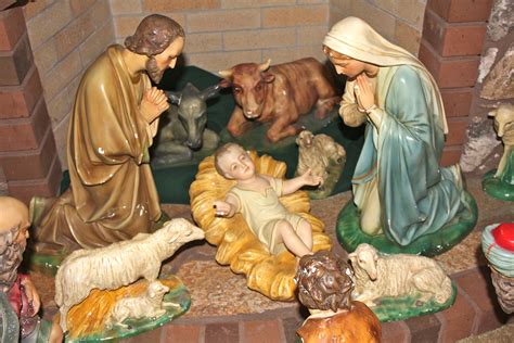 A Nativity Scene With Figurines Of People And Animals