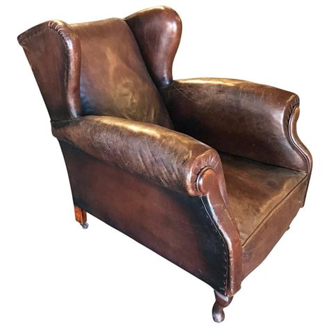 Leather is a traditional option for wing back chairs due to its durability. Wing Back Leather Club Chair For Sale at 1stdibs