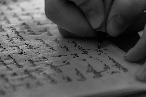 Closeup Of Hand Writing On Paper Stock Photo Download