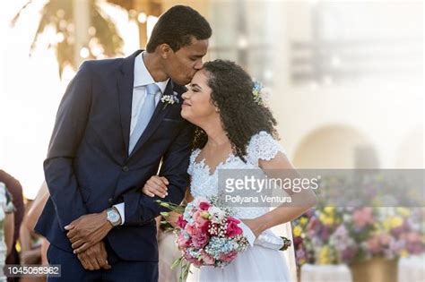 Groom Kisses His Bride On The Forehead High Res Stock Photo Getty Images
