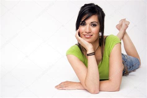 Woman Relaxed Laying On Belly Candid Pose Looking At Camera Stock