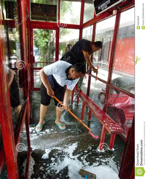 A Cleaning Service Worker Inside The Passenger Car Of The Jakarta Subway Editorial Image