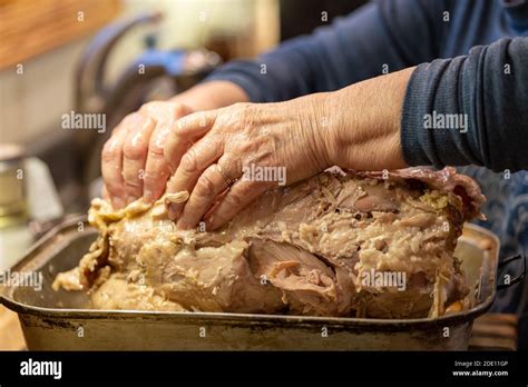 Woman Uses Her Hands To De Bone A Thanksgiving Turkey Removing The