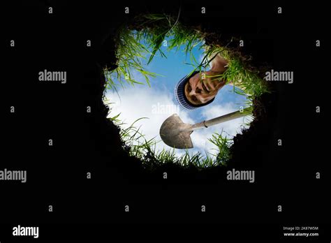 A Man Looking Into A Hole Stock Photo Alamy