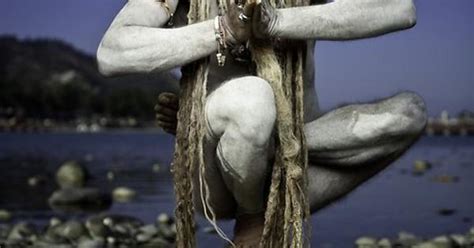 A Naked Sadhu In His Yoga Practice On The Banks Of The Ganges In Haridwar Near The Indian
