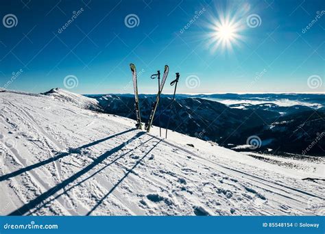 Skis Are In Deep Snow On The Ski Track In Sunny Bright Light Stock