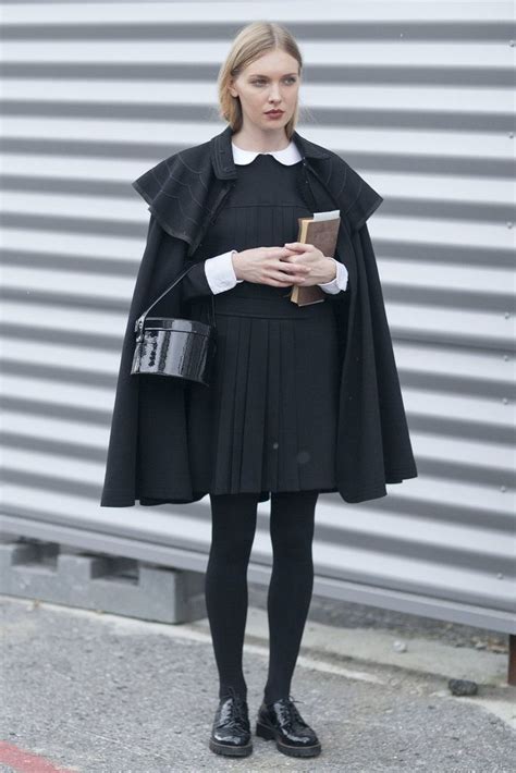 gothic school girl the perfect outfit from the cape to her bag to her classic black tights