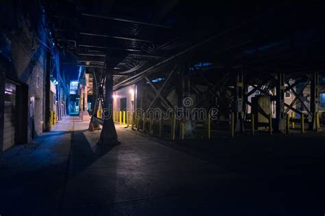 Dark And Scary Downtown Urban City Street Alley At Night Stock Photo